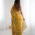 Gold tissue satin embroidered saree with unstitched blouse piece.