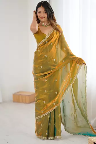 Gold tissue satin embroidered saree with unstitched blouse piece.