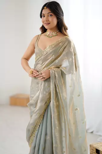 Grey tissue satin embroidered saree with unstitched blouse piece.