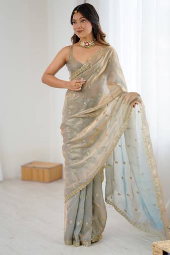 Grey tissue satin embroidered saree with unstitched blouse piece.