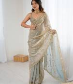 Grey tissue satin embroidered saree with unstitched blouse piece.