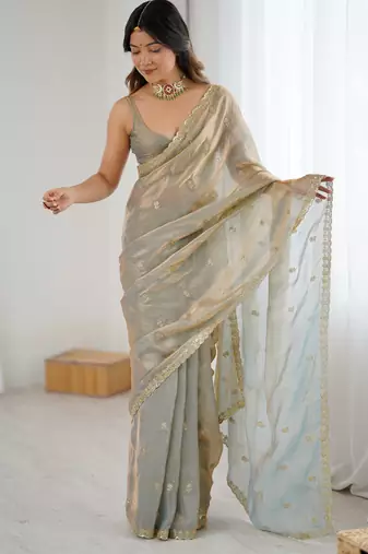 Grey tissue satin embroidered saree with unstitched blouse piece.