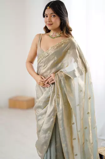 Grey tissue satin embroidered saree with unstitched blouse piece.