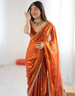 Orange tissue satin embroidered saree with unstitched blouse piece. 2