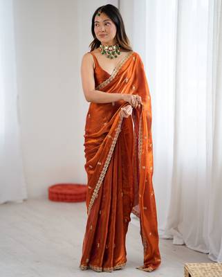 Orange tissue satin embroidered saree with unstitched blouse piece. 1