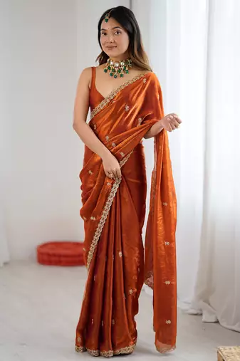 Orange tissue satin embroidered saree with unstitched blouse piece.