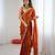 Orange tissue satin embroidered saree with unstitched blouse piece.