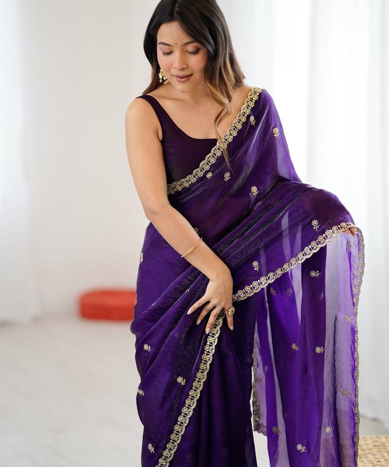 Purple tissue satin embroidered saree with unstitched blouse piece.