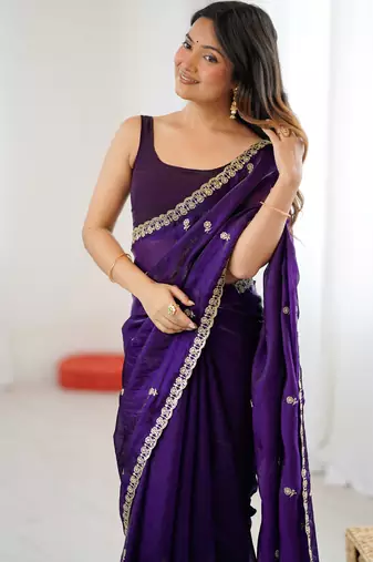Purple tissue satin embroidered saree with unstitched blouse piece.