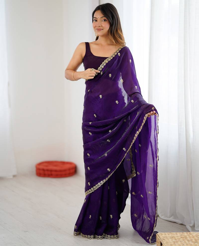 Purple tissue satin embroidered saree with unstitched blouse piece.