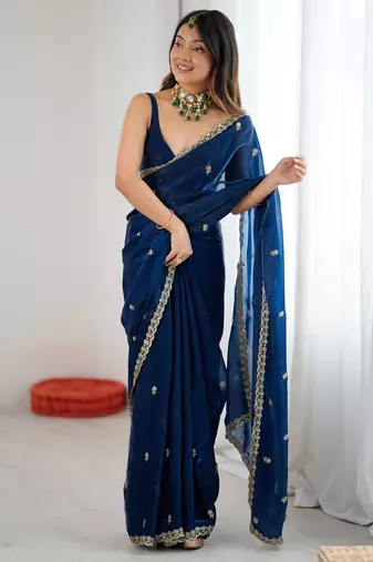 Teal tissue satin embroidered saree with unstitched blouse piece.