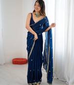 Teal tissue satin embroidered saree with unstitched blouse piece.