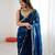 Teal tissue satin embroidered saree with unstitched blouse piece.