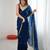 Teal tissue satin embroidered saree with unstitched blouse piece.
