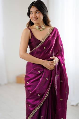 Wine tissue satin embroidered saree with unstitched blouse piece.