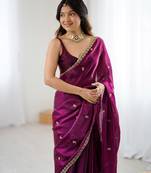 Wine tissue satin embroidered saree with unstitched blouse piece.