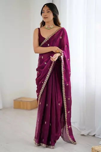 Wine tissue satin embroidered saree with unstitched blouse piece.