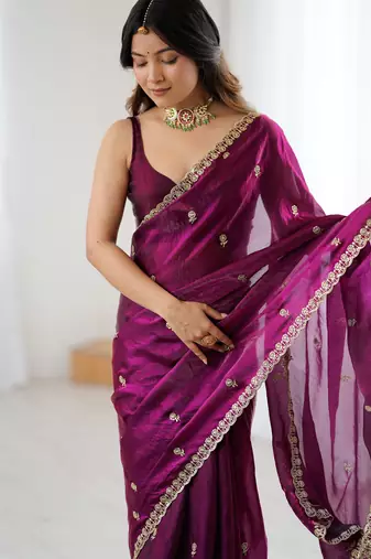 Wine tissue satin embroidered saree with unstitched blouse piece.