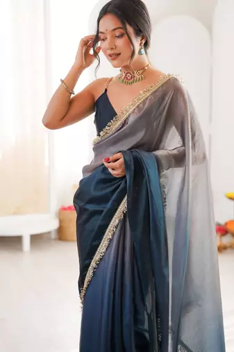 Grey & navy blue tissue satin sequins saree with unstitched blouse piece.
