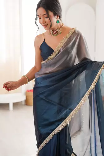Grey & navy blue tissue satin sequins saree with unstitched blouse piece.