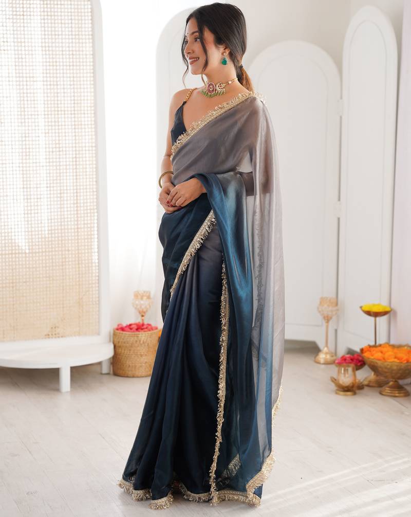 Grey & navy blue tissue satin sequins saree with unstitched blouse piece.