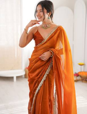 Mustard tissue satin sequins saree with unstitched blouse piece. 1