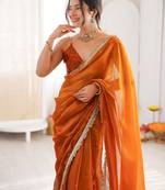 Mustard tissue satin sequins saree with unstitched blouse piece.