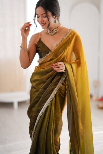 Olive tissue satin sequins saree with unstitched blouse piece.
