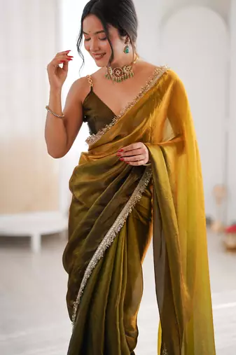 Olive tissue satin sequins saree with unstitched blouse piece.