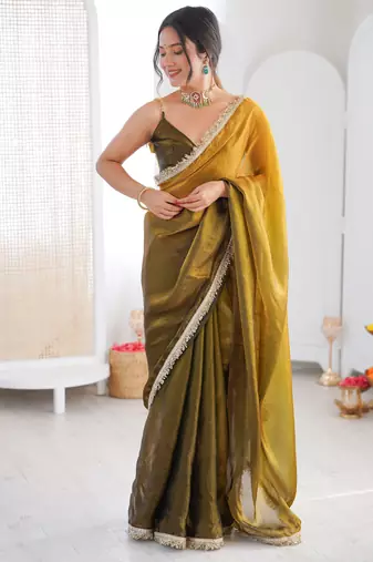 Olive tissue satin sequins saree with unstitched blouse piece.