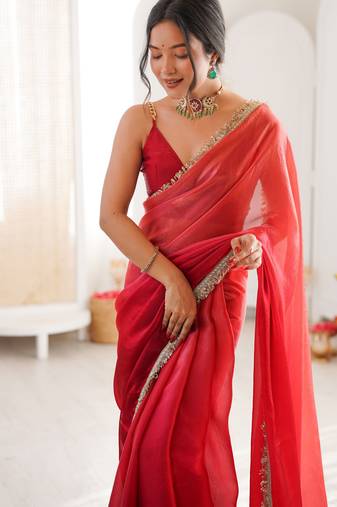 Red tissue satin sequins saree with unstitched blouse piece.