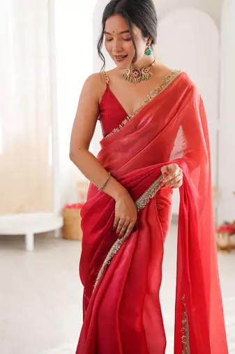 Red tissue satin sequins saree with unstitched blouse piece.