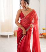 Red tissue satin sequins saree with unstitched blouse piece.