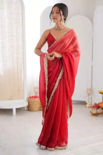 Red tissue satin sequins saree with unstitched blouse piece.