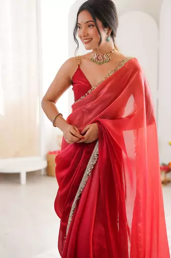 Red tissue satin sequins saree with unstitched blouse piece.