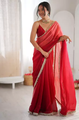 Red tissue satin sequins saree with unstitched blouse piece.