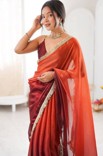 Rust tissue satin sequins saree with unstitched blouse piece.