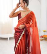 Rust tissue satin sequins saree with unstitched blouse piece.