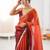 Rust tissue satin sequins saree with unstitched blouse piece.