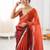 Rust tissue satin sequins saree with unstitched blouse piece.