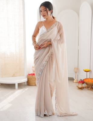 Cream chiffon embellished saree with unstitched blouse piece. 2