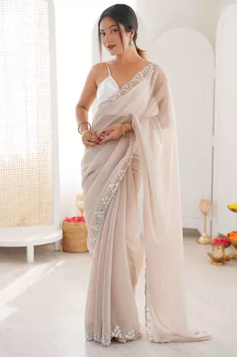 Cream chiffon embellished saree with unstitched blouse piece