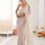 Cream chiffon embellished saree with unstitched blouse piece.
