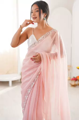 Pink chiffon embellished saree with unstitched blouse piece.