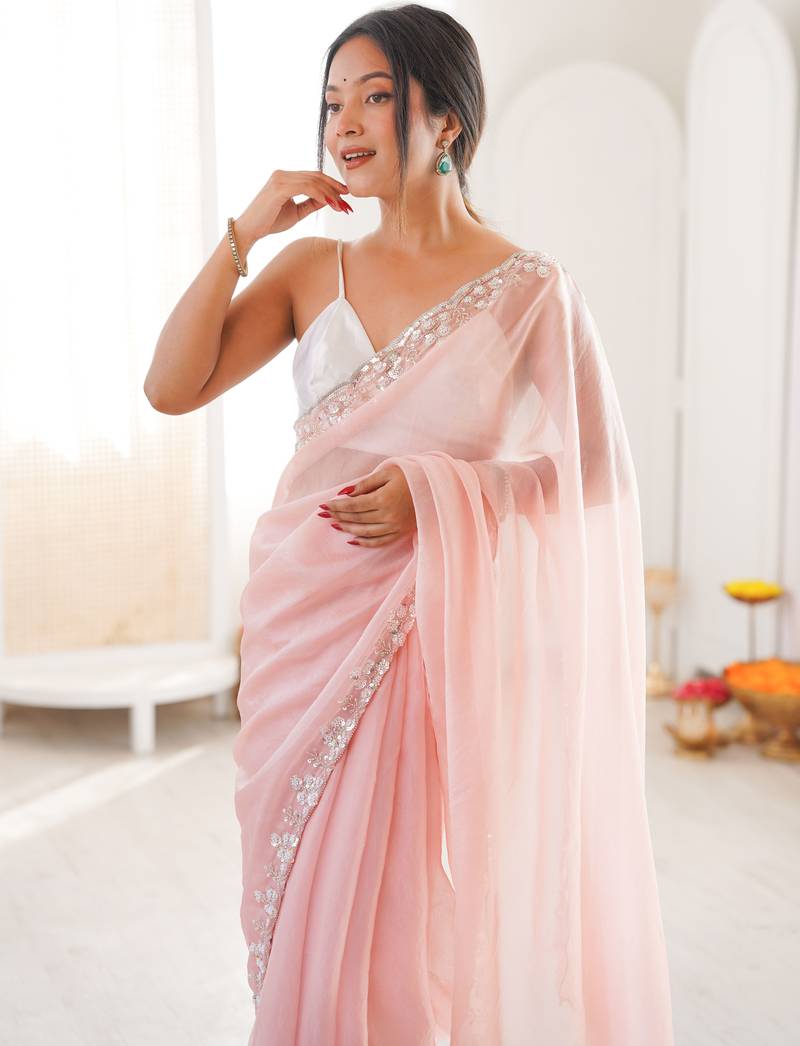 Pink chiffon embellished saree with unstitched blouse piece.