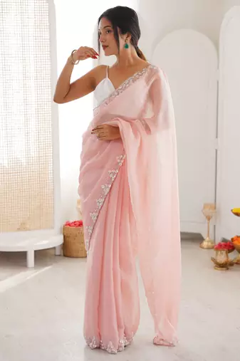Pink chiffon embellished saree with unstitched blouse piece.