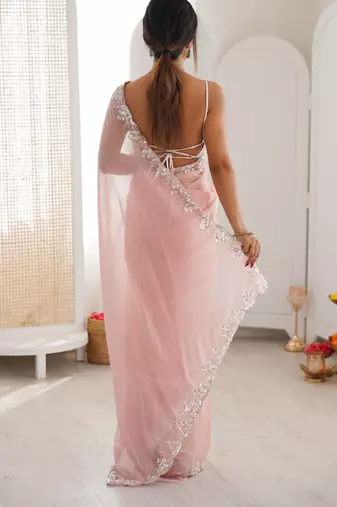 Pink chiffon embellished saree with unstitched blouse piece.