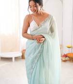 Sea green chiffon embellished saree with unstitched blouse piece.