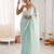 Sea green chiffon embellished saree with unstitched blouse piece.