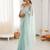 Sea green chiffon embellished saree with unstitched blouse piece.